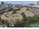 Community aerial view showcasing buildings, landscaping, amenities and surrounding city skyline at 270 E Flamingo Rd # 211, Las Vegas, NV 89169