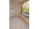 Outdoor balcony with neutral tile flooring, safety rails, and views of surrounding greenery at 270 E Flamingo Rd # 211, Las Vegas, NV 89169