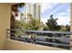 Balcony view of high-rise buildings, palm trees, and lush greenery at 270 E Flamingo Rd # 211, Las Vegas, NV 89169