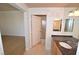 Bathroom with neutral tile flooring, dark countertop, and modern fixtures at 270 E Flamingo Rd # 211, Las Vegas, NV 89169