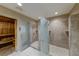 Elegant bath and shower room featuring glass door showers, tiled walls, and a luxurious wood sauna at 270 E Flamingo Rd # 211, Las Vegas, NV 89169