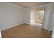This bedroom features hardwood floors and balcony access at 270 E Flamingo Rd # 211, Las Vegas, NV 89169