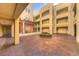 An inviting courtyard featuring an outdoor seating and well-maintained landscaping at 270 E Flamingo Rd # 211, Las Vegas, NV 89169