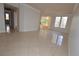 Living room features neutral paint, and sleek tile flooring, plus balcony access for a bright and inviting atmosphere at 270 E Flamingo Rd # 211, Las Vegas, NV 89169