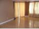 Spacious living room with large windows and tile floors at 270 E Flamingo Rd # 211, Las Vegas, NV 89169