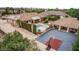 Expansive aerial view of a home highlighting the pool, basketball court, and lush landscaping at 2730 El Camino Rd, Las Vegas, NV 89146