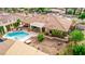 An aerial view capturing the sparkling pool, relaxing spa, and meticulously landscaped backyard oasis at 2730 El Camino Rd, Las Vegas, NV 89146
