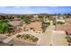 Expansive aerial view showcases a well-maintained home with a circular driveway and lush landscaping at 2730 El Camino Rd, Las Vegas, NV 89146