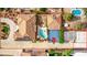 Expansive aerial view showcasing a luxurious home with a pool, basketball court, and landscaped backyard at 2730 El Camino Rd, Las Vegas, NV 89146