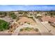 Beautiful aerial view of a home featuring a circular driveway, a lush yard, and mature landscaping at 2730 El Camino Rd, Las Vegas, NV 89146