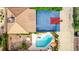 Detailed aerial shot of a backyard featuring a pool, hot tub, and a full-sized basketball court at 2730 El Camino Rd, Las Vegas, NV 89146