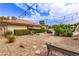 Charming backyard with desert landscaping, patio lights, and seating area, creating a cozy outdoor retreat at 2730 El Camino Rd, Las Vegas, NV 89146