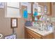 Bathroom featuring a marble countertop and framed mirror at 2730 El Camino Rd, Las Vegas, NV 89146