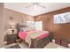 Comfortable bedroom features neutral walls, ceiling fan, and nicely appointed furniture at 2730 El Camino Rd, Las Vegas, NV 89146