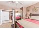 Bedroom view shows a large bed and a mirrored closet with an attached bathroom at 2730 El Camino Rd, Las Vegas, NV 89146