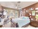 Charming bedroom features a ceiling fan, decorative garland, and unique wall decor at 2730 El Camino Rd, Las Vegas, NV 89146