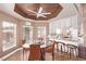 View from the breakfast nook into the kitchen with tile floors and lots of natural light at 2730 El Camino Rd, Las Vegas, NV 89146