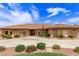 Single-story home with tile roof, large driveway, and desert landscaping at 2730 El Camino Rd, Las Vegas, NV 89146