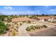 Expansive front exterior with a circular driveway, mature landscaping, and a well-maintained lawn at 2730 El Camino Rd, Las Vegas, NV 89146