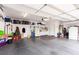 Spacious garage with ample storage, shelving units, and a clean epoxy floor at 2730 El Camino Rd, Las Vegas, NV 89146