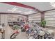 A spacious garage featuring multiple motorcycles and a comfortable seating area at 2730 El Camino Rd, Las Vegas, NV 89146