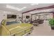 A bright garage featuring a classic car, motorcycle and lounge area, with high ceilings and skylights at 2730 El Camino Rd, Las Vegas, NV 89146