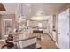 Spacious kitchen with granite counters, an island, tile floors, and stainless steel appliances at 2730 El Camino Rd, Las Vegas, NV 89146