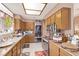 Bright kitchen with wooden cabinets and countertops, and stainless steel appliances at 2730 El Camino Rd, Las Vegas, NV 89146