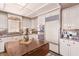 Well-appointed kitchen with custom cabinets, built-in appliances, and a functional center island at 2730 El Camino Rd, Las Vegas, NV 89146