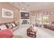 Inviting living space with a cozy fireplace, ample seating, and neutral decor at 2730 El Camino Rd, Las Vegas, NV 89146