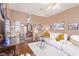 Spacious living room with hardwood floors and comfortable white sofas at 2730 El Camino Rd, Las Vegas, NV 89146