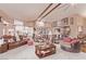 Open-concept living area with comfortable sofas, decorative furnishings, and seamless flow to other rooms at 2730 El Camino Rd, Las Vegas, NV 89146