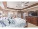 Spacious primary bedroom boasts a ceiling fan, sliding door access, and carpet floors at 2730 El Camino Rd, Las Vegas, NV 89146
