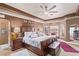 Relaxing primary bedroom featuring neutral walls and carpet floors and ceiling fan at 2730 El Camino Rd, Las Vegas, NV 89146