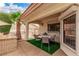 Charming outdoor patio featuring a built-in grill and a cozy dining area with stylish decor at 2730 El Camino Rd, Las Vegas, NV 89146