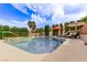 Beautiful pool and spa area complete with sun loungers and lush landscaping at 2730 El Camino Rd, Las Vegas, NV 89146