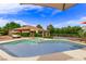 Sparkling pool and spa surrounded by lush landscaping, providing a tranquil outdoor oasis at 2730 El Camino Rd, Las Vegas, NV 89146