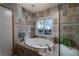 Bathroom with large soaking tub and walk-in shower at 2917 Chapala Dr, Las Vegas, NV 89120