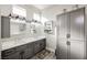 Double vanity with gray cabinets and quartz countertop at 3012 Anna Bay Dr, Las Vegas, NV 89134