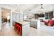 Modern kitchen island with red stools and a built-in butcher block at 3012 Anna Bay Dr, Las Vegas, NV 89134