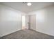 Simple bedroom with carpet and access to hallway at 3012 Holly Hill Ave, Las Vegas, NV 89104