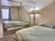 Bedroom with mirrored closet and window at 3318 N Decatur Blvd # 2068, Las Vegas, NV 89130
