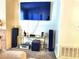 Living room with large TV, stereo system, and seating at 3318 N Decatur Blvd # 2068, Las Vegas, NV 89130