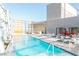 Outdoor pool with lounge chairs, cabanas, and stunning city views for relaxation and enjoyment at 3722 Las Vegas Blvd # 1004, Las Vegas, NV 89158