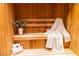 Relaxing sauna featuring wood paneling, bench, and a white robe for a comfortable experience at 3722 Las Vegas Blvd # 1004, Las Vegas, NV 89158