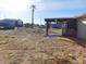 Backyard with a partial view of a palm tree and covered patio at 3748 Skyline St, Logandale, NV 89021