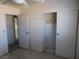 Bright bedroom featuring a ceiling fan and built-in closet at 3748 Skyline St, Logandale, NV 89021