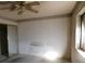 Spacious bedroom with mirrored closet and ceiling fan at 3748 Skyline St, Logandale, NV 89021