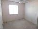 Spacious bedroom with ceiling fan and ample closet space at 3748 Skyline St, Logandale, NV 89021