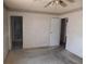 Bedroom with access to bathroom and ceiling fan at 3748 Skyline St, Logandale, NV 89021